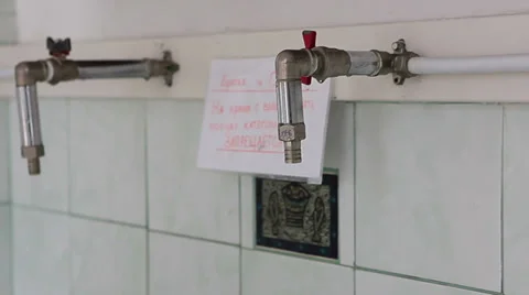 Taps for pouring water blessed by priest for religious purposes Stock Footage 38558287
