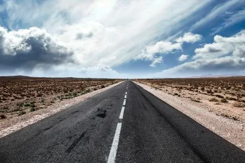 Tar road bends a corner. Stock Photos