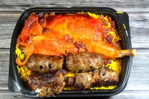 Tarb minced meat Kofta wrapped in a layer of lamb fat caul fat then charcoa.. Stock Photos
