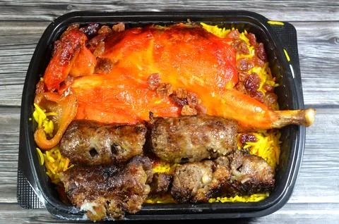Tarb minced meat Kofta wrapped in a layer of lamb fat caul fat then charcoa.. Stock Photos