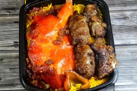 Tarb minced meat Kofta wrapped in a layer of lamb fat caul fat then charcoa.. Stock Photos