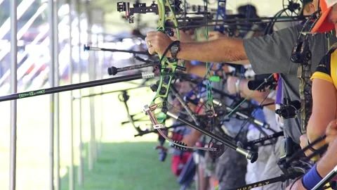 Target archery competition shooting bows and arrows Stock Footage 171996569