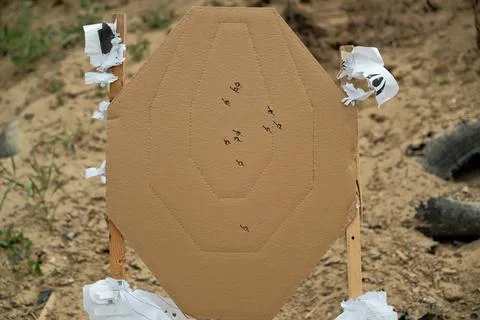 Target at the shooting range. target with bullet holes Stock Photos