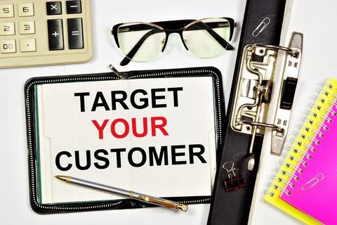 Target your customer. A text label in the working notepad. Stock Photos
