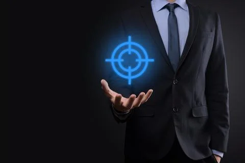 Targeting concept with businessman hand holding target icon dartboard sketch Stock Photos