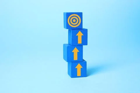Targeting. Stacked cubes with arrows pointing at bullseye on top cube again.. Stock Photos