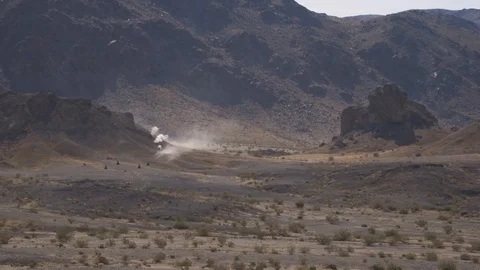 Targets exploding from ammunition in desert Stock Footage 113453268