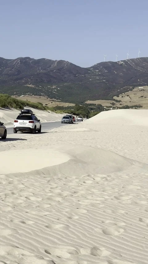 Tarifa dunes road at Playa de Valdevaqueros coastal landscape Stock Footage 333387371