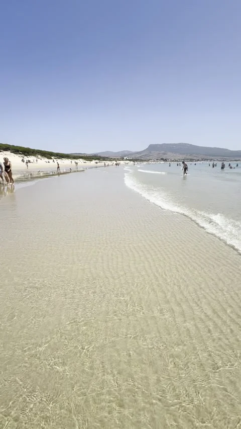 Tarifa summer walk at Duna de Bolonia beach Video stock 333189990