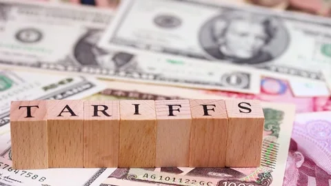 TARIFFS letters and banknotes (US dollar, Japanese yen, Chinese yuan) rotating Stock Footage 321213361
