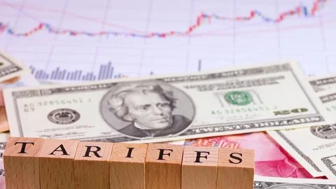 TARIFFS letters, banknotes and graphs rotating Stock Footage 314201971