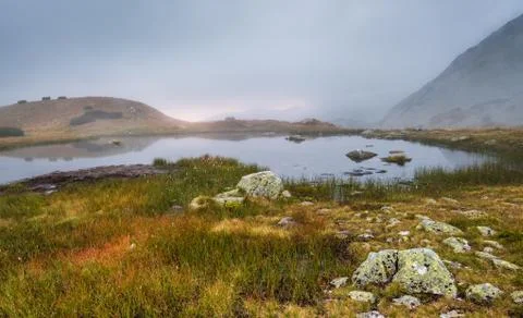Tarn in Mountains at Sunset Stock Photos