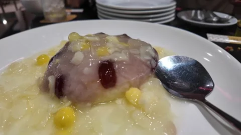 Taro dessert with corn and coconut milk Stock Footage 325649687