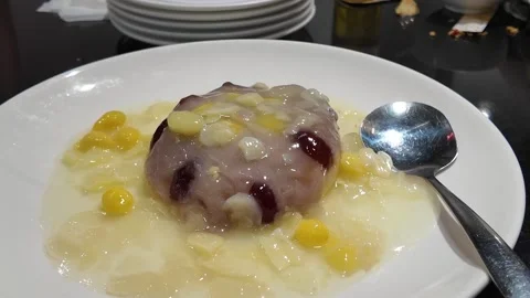 Taro dessert with corn and coconut milk Stock Footage 325649688