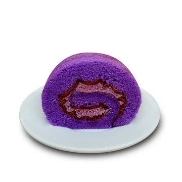 Taro flavored rolled sponge cake on a plate. Isolated white background 스톡 사진