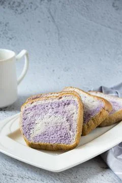 Taro flavour soft bread in white plate 写真素材
