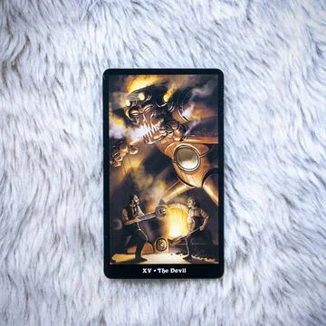 Tarot card the Devil on fur background, fortune telling and predictions Stock Photos