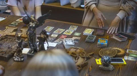 Tarot card reader arranges cards in a card spread. Fortune-telling concept Stock Photos