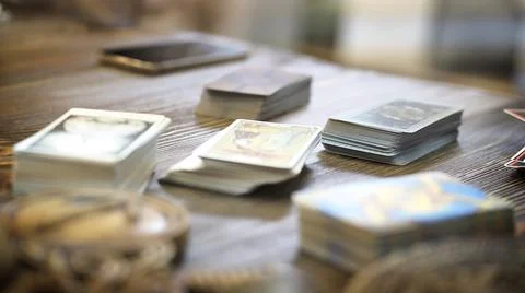 Tarot card reader arranges cards in a card spread. Fortune-telling concept Stock Photos