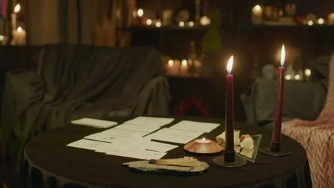 Tarot Cards Layout and Burning Candles on Table Stock Footage 247641187
