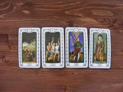 Tarot cards medieval close up, The Triplets (three) of Tarot Decks on wooden Stock Photos