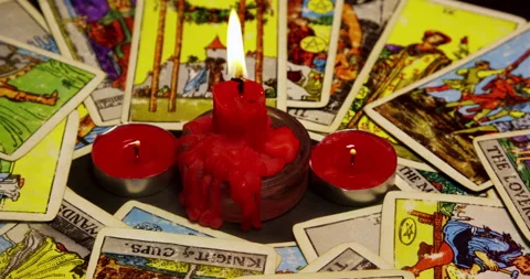 Tarot Cards Reading and red candles burning down Stock Footage 243363359