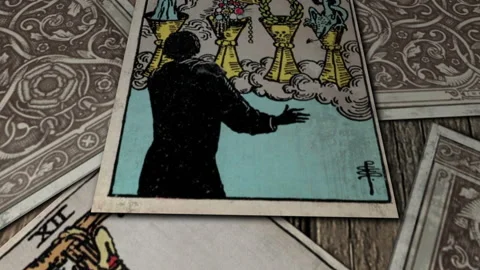 Tarot Divination Seven of cups card, magician and golden cups. Occult. Close up Stock Footage 132827894