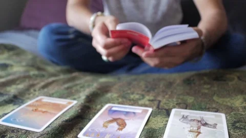 The tarot is a pack of playing Tarot cards Reader Reading Future And Fortune Stock Footage 105367099