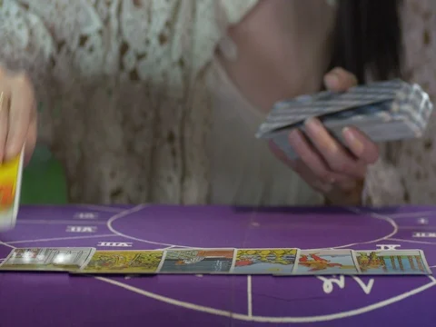 Tarot reader dealing cards &amp; reading future and fortune Stock Footage 76712291