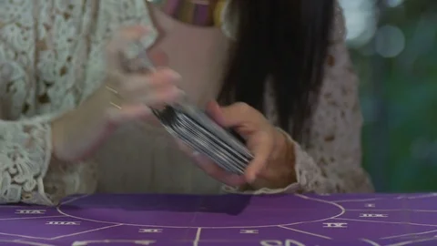 Tarot reader dealing cards &amp; reading future and fortune Stock Footage 76716768