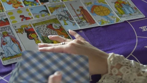 Tarot reader dealing cards & reading future and fortune Stock Footage
