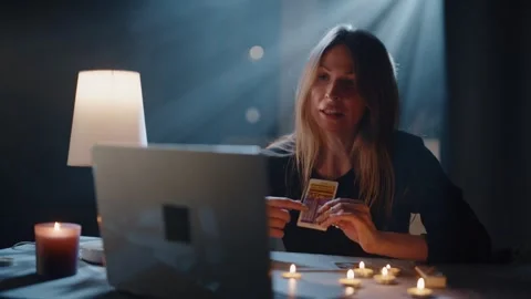 A Tarot Reader Makes A Reading Through A Computer 스톡 동영상 299709448