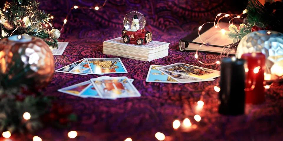 Tarot reader or Fortune teller reading on Christmas decoration. Stock Photos