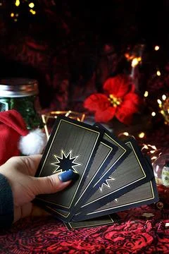 Tarot reader or Fortune teller reading on Christmas decoration. Stock Photos