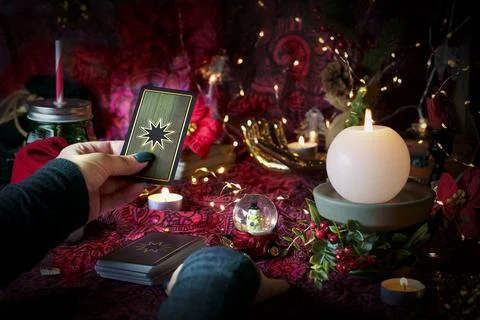 Tarot reader or Fortune teller reading on Christmas decoration. Stock Photos