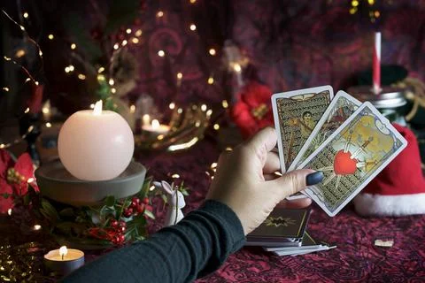 Tarot reader or Fortune teller reading on Christmas decoration. Stock Photos