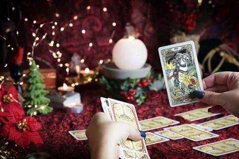 Tarot reader or Fortune teller reading on Christmas decoration. Stock Photos