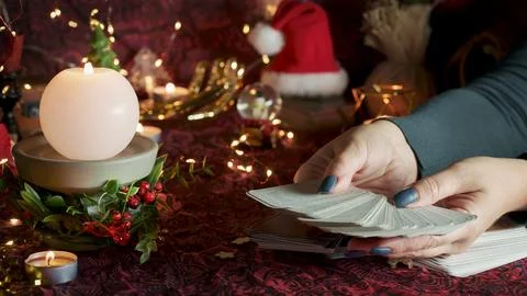 Tarot reader or Fortune teller reading on Christmas decoration. Stock Photos