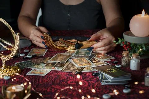 Tarot reader or Fortune teller reading on Christmas decoration. Stock Photos