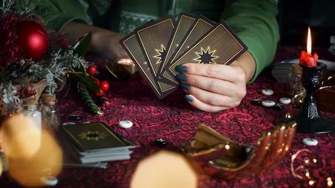 Tarot reader or Fortune teller reading on Christmas decoration. Stock Photos