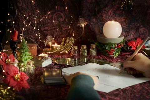 Tarot reader or Fortune teller reading on Christmas decoration. Stock Photos