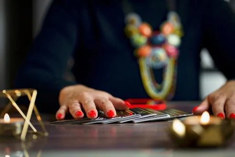 Tarot reader or fortune teller holding tarot cards Stock Photos