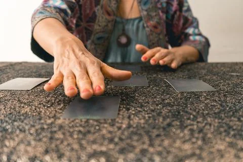 Tarot reader preparing to reveal the cards, building anticipation for the r.. Stock Photos