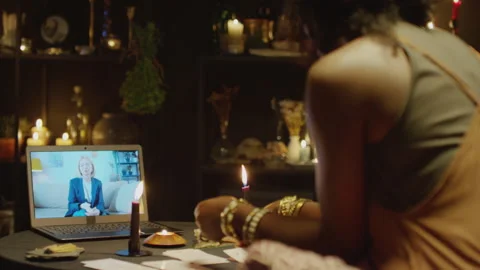 Tarot Specialist Making Layout in front of Laptop Screen Stock Footage 247635449