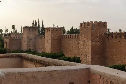 Taroudant old medieval defensive wall and palms alley, Morocco Stock Photos