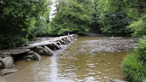 Tarr Steps, clapper bridge, Exmoor National Park, Somerset, UK Stock Footage 80145607