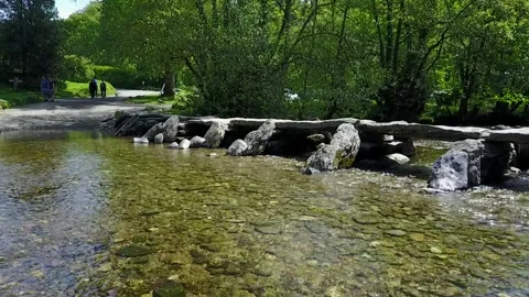Tarr Steps Clapper Bridge, Megalith, Exmoor UK, Low Gliding Drone Clip HD Stock Footage 315077816