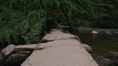 Tarr Steps showing the iconic clapper bridge stretching across the River Barle Stock-Footage 343898183