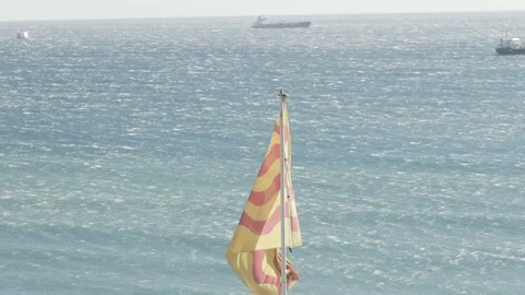 Tarragona Flag in Slow motion Over Ocean Video stock 119242865