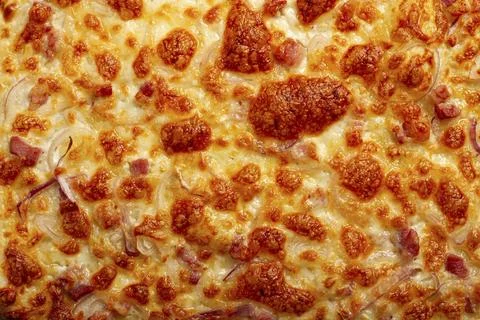 Tart flambe, open pie, rectangular pizza, with cheese and red onion, bacon 스톡 사진